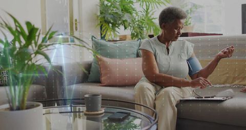 Senior Woman Monitoring Blood Pressure with Digital Interface at Home - Download Free Stock Images Pikwizard.com