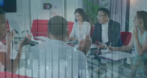 Diverse Business Team Analyzing Economic Data Charts