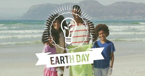 Family Volunteering on Beach for Earth Day Holding Green Trash Bag Wearing Gloves