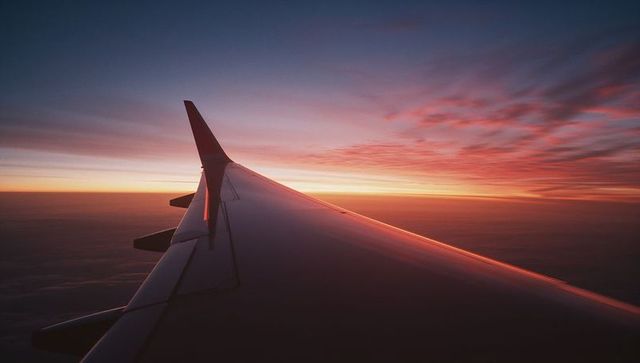 Airplane Wingpanorama at Sunrise Offering Tranquil High Altitude View