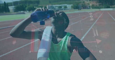 Athlete Hydrating on Track with Fitness Data Overlays
