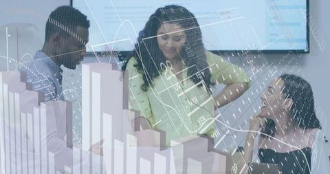 Business team analyzing financial charts and analytics dashboards in modern office meeting