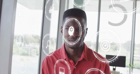 Businessman Presenting Futuristic HUD Analytics and Data Charts in Modern Office
