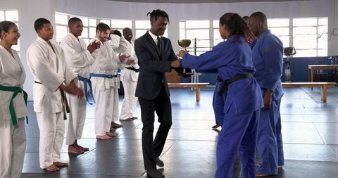 Martial Arts Achievement in Dojo Demonstrating Victory and Discipline