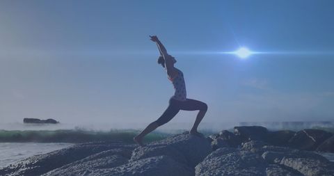 Woman Practicing Yoga on Rocky Shore at Sunrise - Download Free Stock Images Pikwizard.com