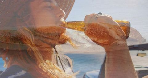Bearded man drinking from amber bottle at marina with wood-grain double exposure