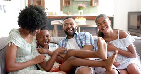 Joyful Family Bonding Time on Living Room Sofa - Download Free Stock Images Pikwizard.com