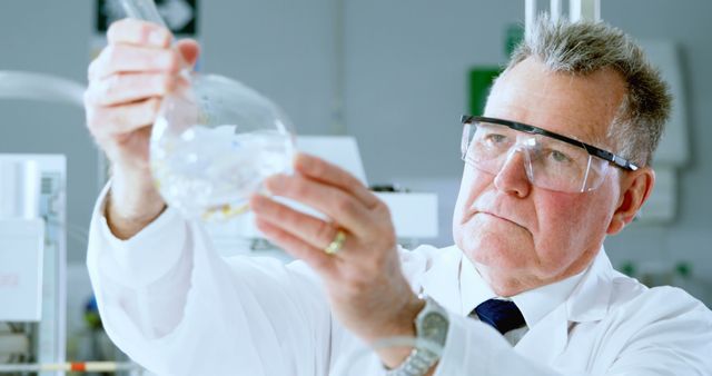 Senior Scientist Conducting Laboratory Research with Lab Flask - Download Free Stock Images Pikwizard.com