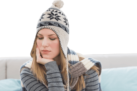 Bored caucasian woman in winter cap on transparent background