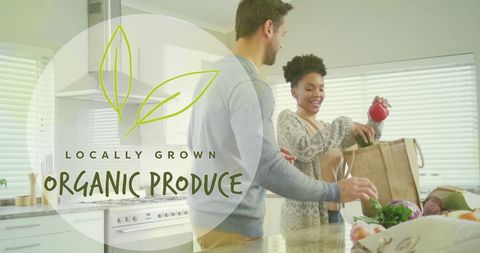 Diverse Couple Enjoying Fresh Organic Produce in Modern Kitchen