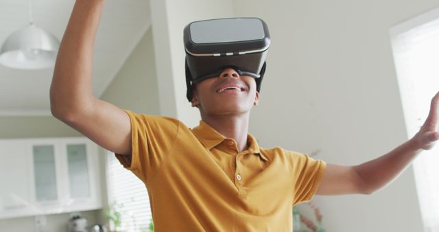 Enthusiastic Teenager Experiencing Virtual Reality at Home - Download Free Stock Images Pikwizard.com