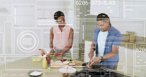 Couple cooking on kitchen island with digital overlays, chopping vegetables, smart kitchen