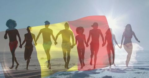 Friends running on sunlit beach holding hands with tricolor overlay and sun flare