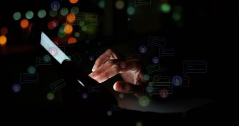 Woman tapping smartphone at night with glowing chat notifications and neon moody bokeh lights