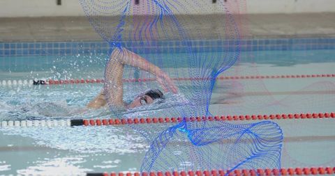 Adult male swimmer performing front crawl in lap pool