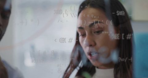 Team Analyzing Complex Data on Transparent Screen