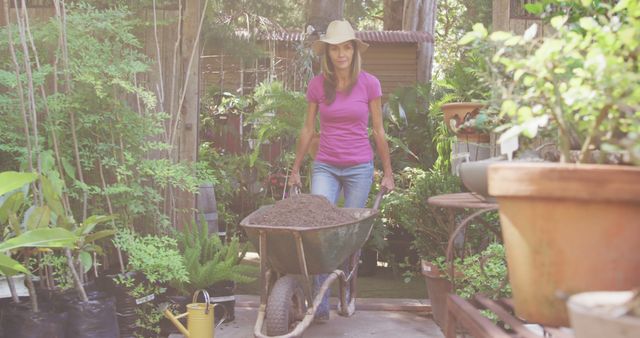 Woman Working in Garden with Wheelbarrow - Download Free Stock Images Pikwizard.com