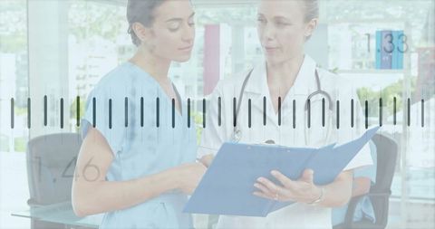 Medical professionals reviewing patient file in modern clinic