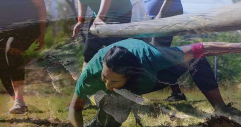 Woman Crawling Under Obstacle Outdoor Fitness Challenge