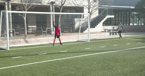 Student Kicking Soccer Ball Towards Goal on School Field - Download Free Stock Images Pikwizard.com