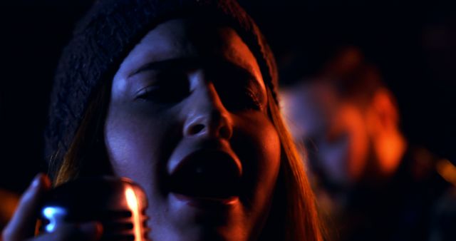 Woman Singing in Dark Moody Lighting with Retro Microphone - Download Free Stock Images Pikwizard.com