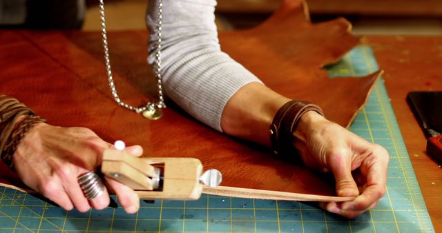 Artisan crafting leather with precision tools in workshop - Download Free Stock Images Pikwizard.com