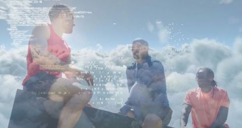 Athletes Discussing Technology on Mountain Adventure Above Clouds