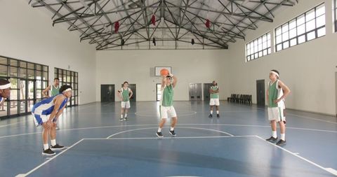 Diverse Basketball Team Practicing Free Throws in Gym