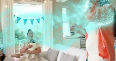 Creating magical baby shower moment with joyful guests and babies in sunlit living room
