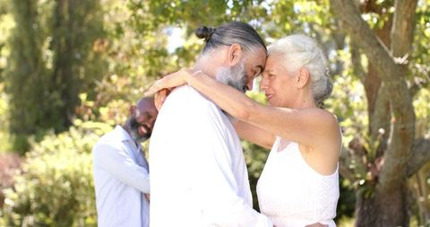 Senior Couple Embracing at Outdoor Wedding Ceremony - Download Free Stock Images Pikwizard.com