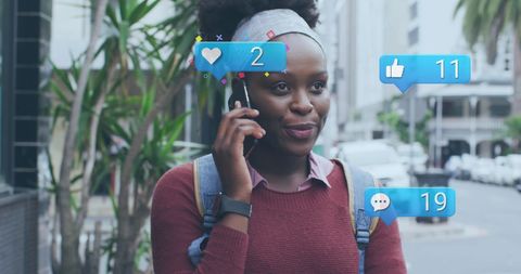 African American Woman Using Smartphone with Social Media Integration