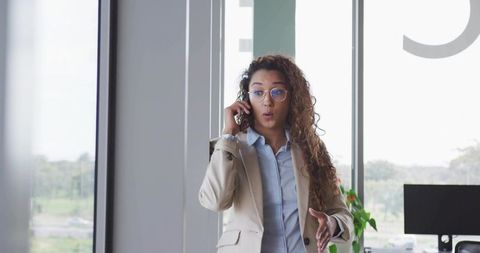 Businesswoman Discussing Solutions on Phone in Stylish Office