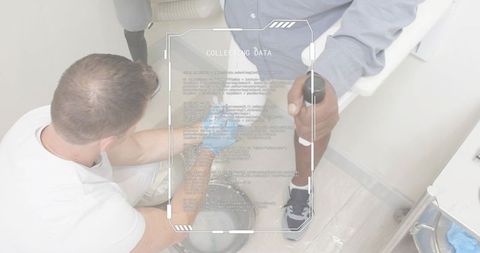 Clinician treating lower leg with forearm crutch and prosthetic hud collecting data