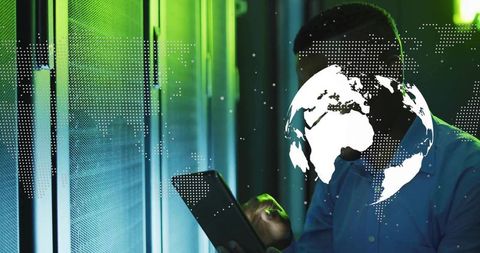 Technician Monitoring Servers with Digital Globe Overlay in Futuristic Setting