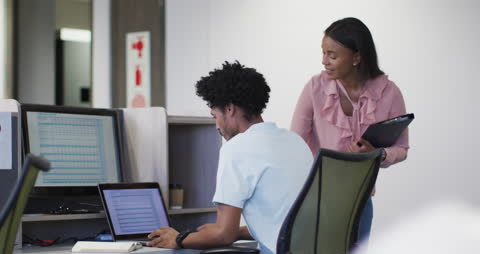 Coworkers Engaging in Office Collaboration Using Technology