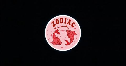 Mystical zodiac emblem with pisces and stella motifs on black