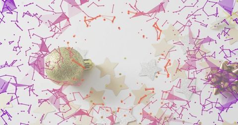 Gold Glitter Bauble Resting on White Flat-Lay with Star Confetti and Purple Overlay