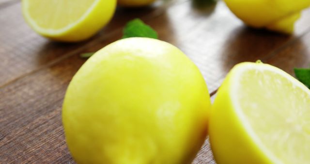 Fresh Lemons with Mint Leaves on Wooden Surface - Download Free Stock Images Pikwizard.com
