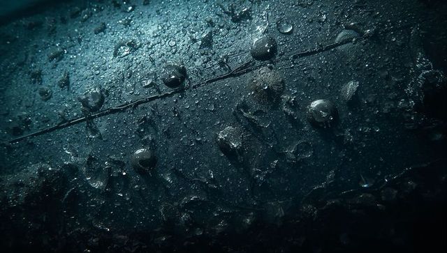 Macro wet metal hull with rivets and water droplets, dark moody industrial texture