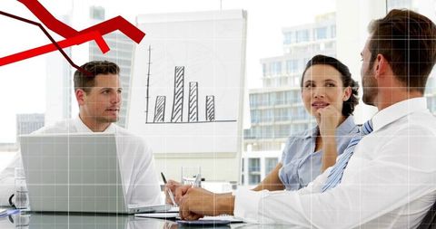 Three professionals discussing business strategy with declining sales chart and red arrow