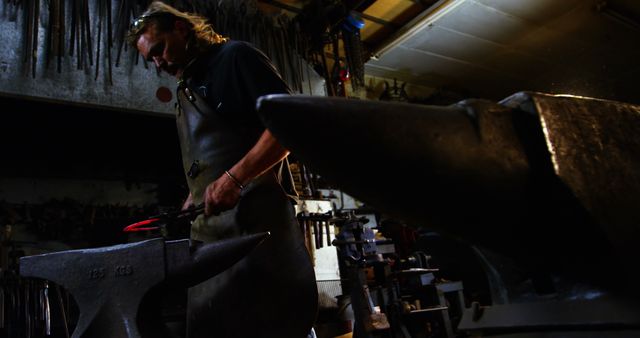 Blacksmith Forging Metal in Workshop with Anvil - Download Free Stock Images Pikwizard.com