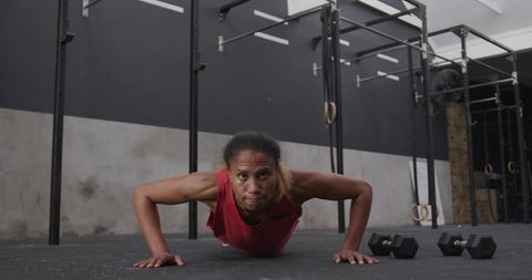 African American Athlete Doing Push-Ups in CrossFit Gym