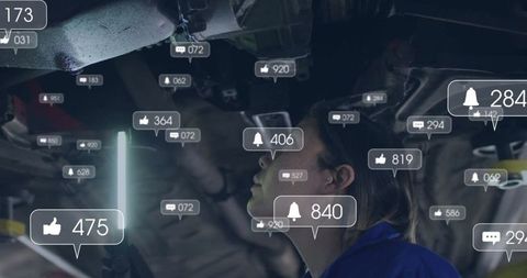 Technician Using LED Wand While Inspecting Vehicle in Digital Environment