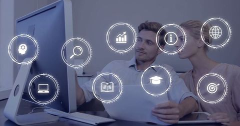 Business Professionals Reviewing Data with Technology Interface