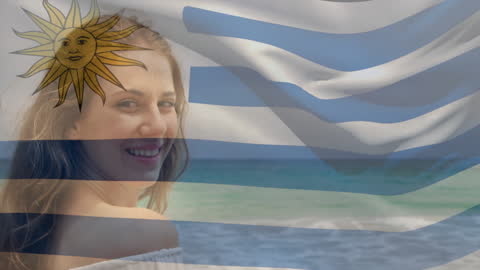 Joyful Woman at Beach Expressing Patriotism for Uruguay
