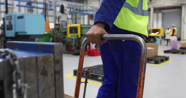 Factory Worker Moving Pallet on Warehouse Floor - Download Free Stock Images Pikwizard.com