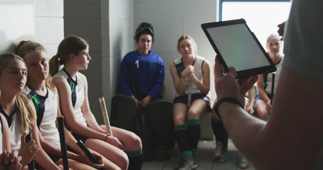 Female Field Hockey Team Receiving Strategy Tutorial in Locker Room - Download Free Stock Images Pikwizard.com