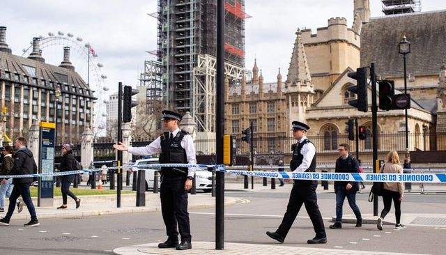 London police directing pedestrians at cordoned westminster near elizabeth tower