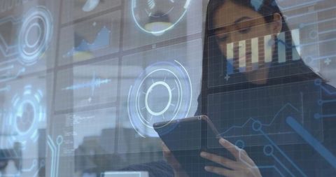 Businesswoman Studying Tablet with Holographic HUD and Data Analytics Dashboards in Office