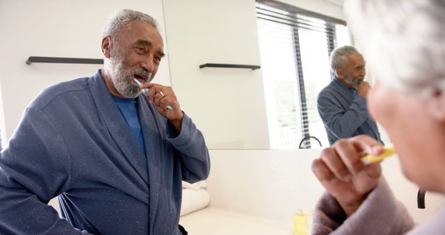 Elderly Couple Brushing Teeth Together in Bathroom - Download Free Stock Images Pikwizard.com